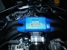 First modification.  Painted plastic engine cover to match the World Rally Blue exterior.