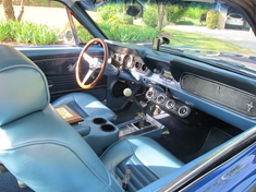 Interior has since been updated with new door panels - and am currently building a custom center console that looks nicer. The seats are recovered seats from a 1993 LX Mustang (much more comfortable and have locking backs and headrests). Steering wheel is a Grant Signature Series Mahogany wheel; radio is a Retrosound Model One. Everything else stock!