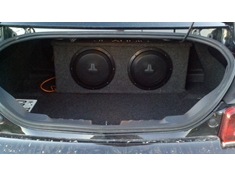 2 JL 10&quot; subs in a stealth box (small size intended for putting behind third row seats of SUVs, such as Tahoes). Kicker monoblock amp.